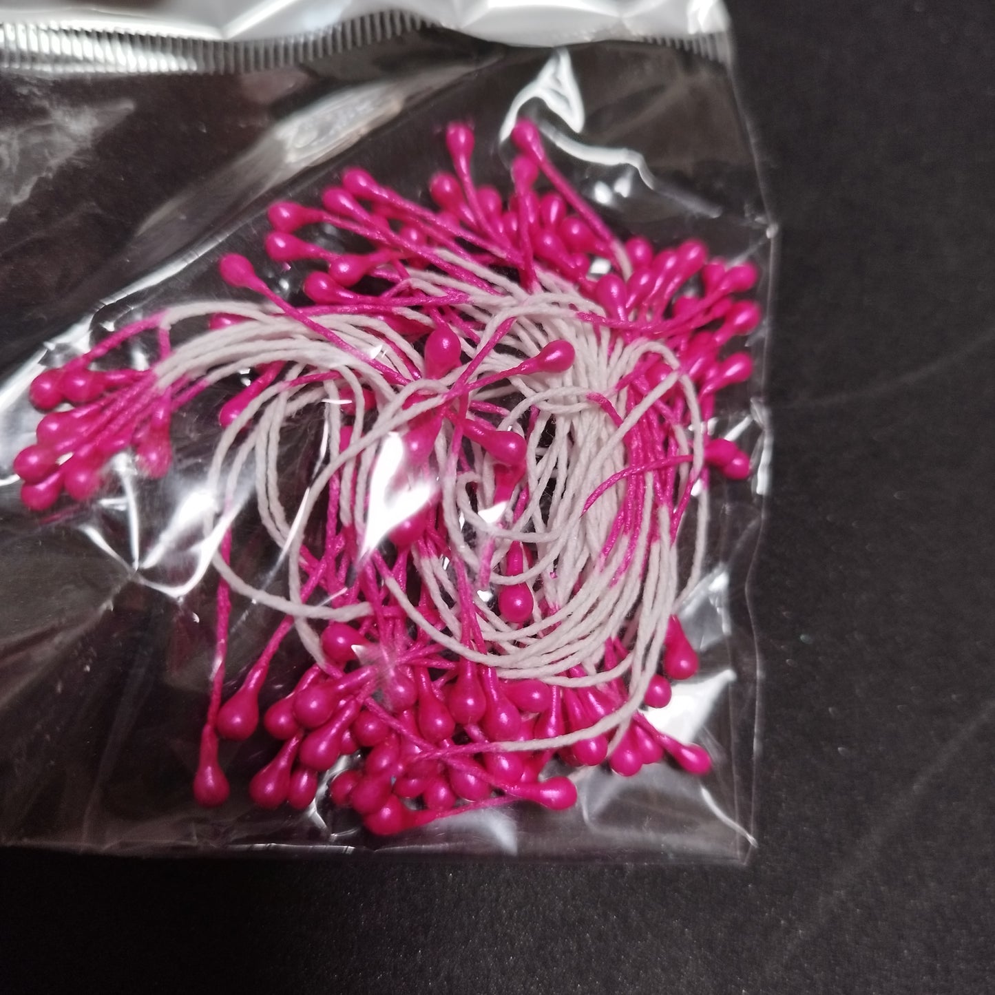 Pistilos perlados rosa fucsia