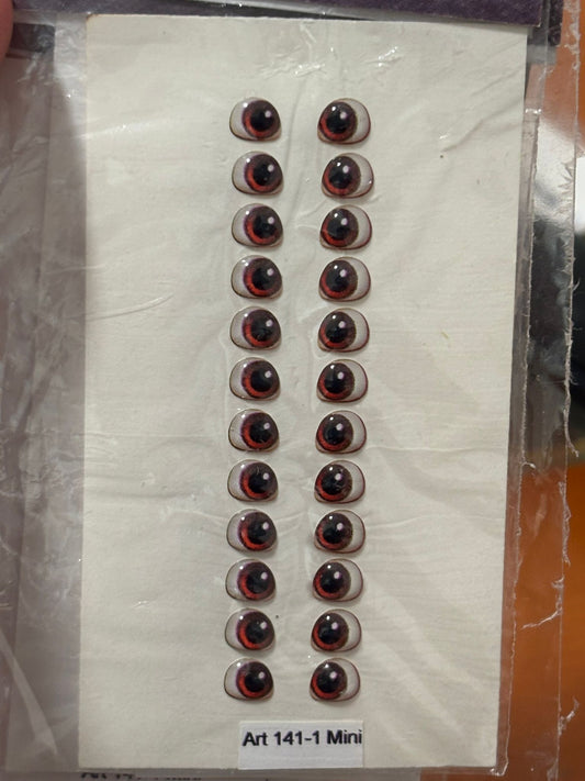 Ojitos Resinados 141  Marrones 4mm